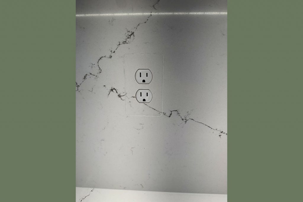 Outlet with quartz integrated cover